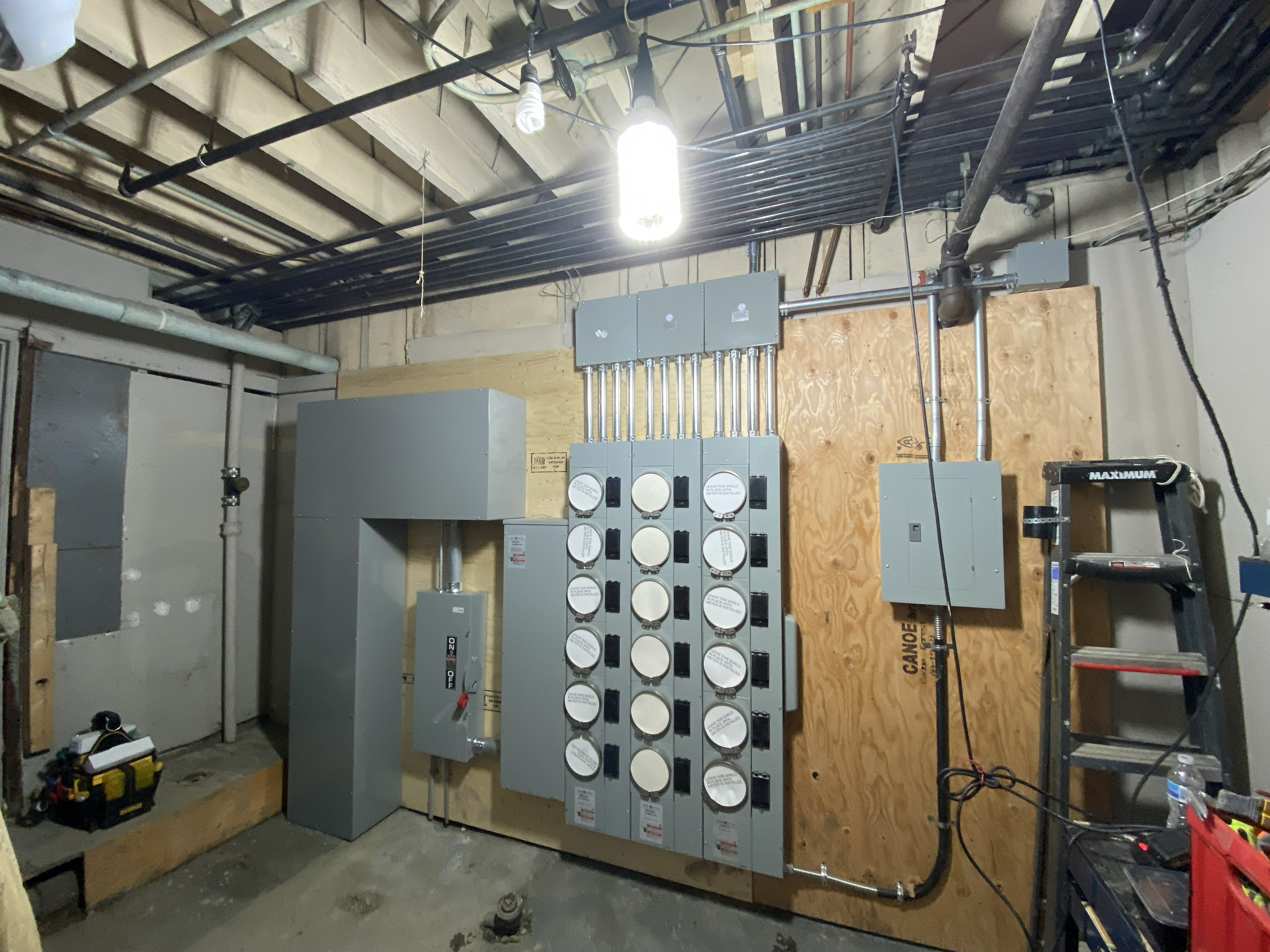 Licensed electrician wiring a commercial renovation project in Greater Vancouver