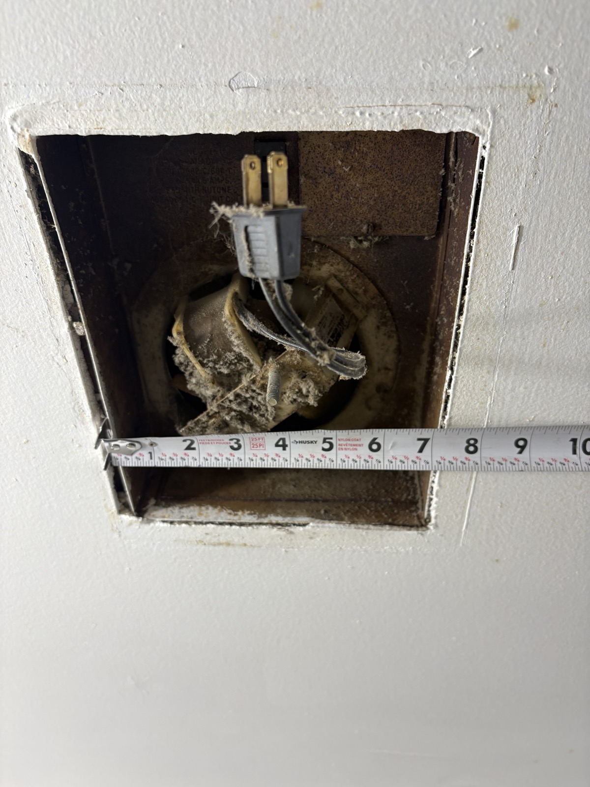 Old dirty exhaust fan before replacement